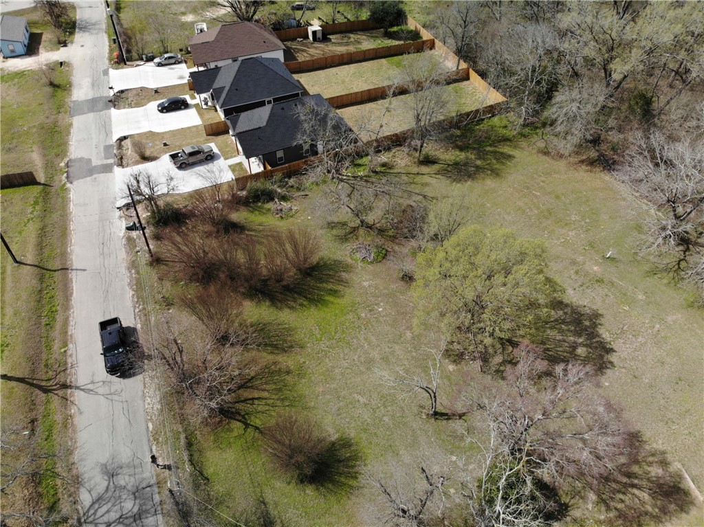 1001 Hunters Lane Bryan, TX 77803 - Photo 20 of 23 a aerial view of residential house with pool and trees all around
