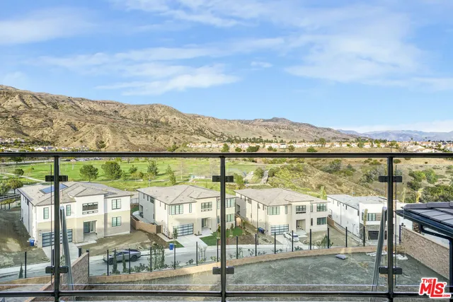 a view of a white building among the city view and a building