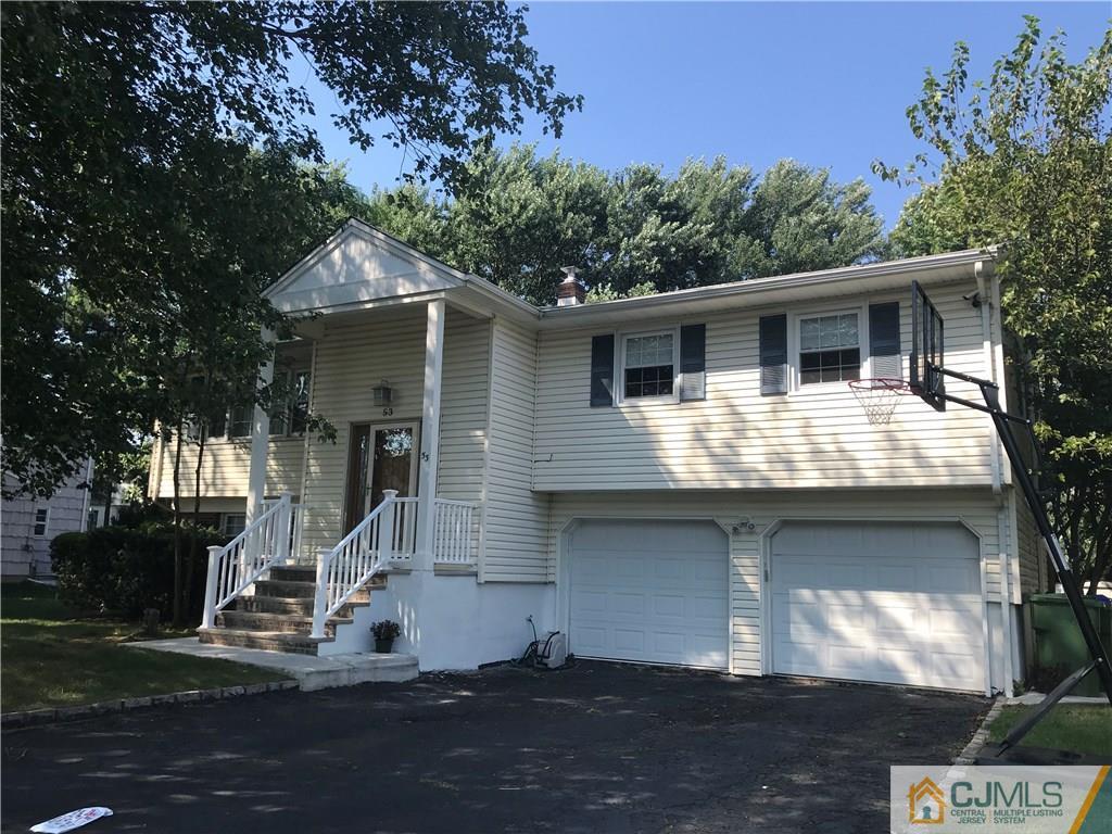 53 Lynnwood Road Edison, NJ 08820 - Photo 1 of 19 a front view of a house with garage