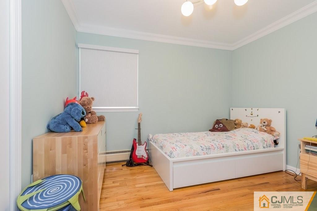 53 Lynnwood Road Edison, NJ 08820 - Photo 11 of 19 a bedroom with a bed and a couch
