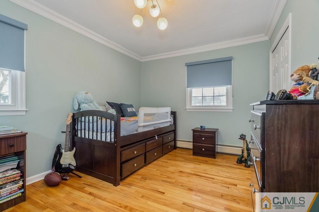 53 Lynnwood Road Edison, NJ 08820 - Photo 12 of 19 a view of a bedroom with furniture and wooden floor