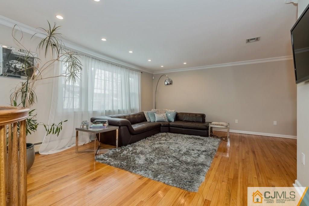 53 Lynnwood Road Edison, NJ 08820 - Photo 3 of 19 a living room with furniture and a rug