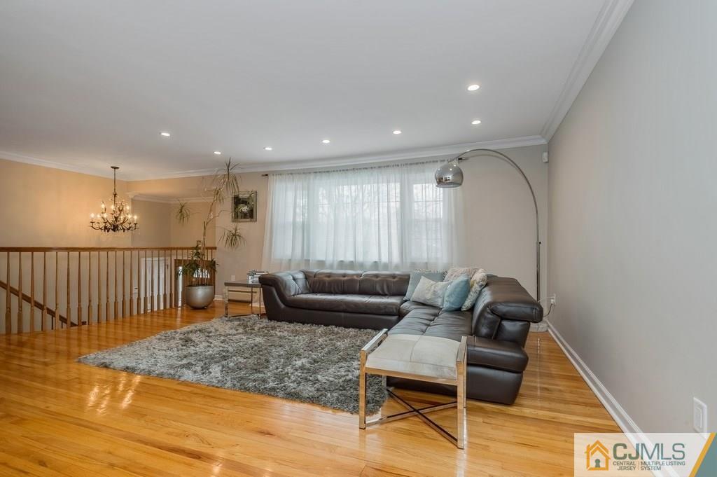 53 Lynnwood Road Edison, NJ 08820 - Photo 4 of 19 a living room with furniture and a wooden floor