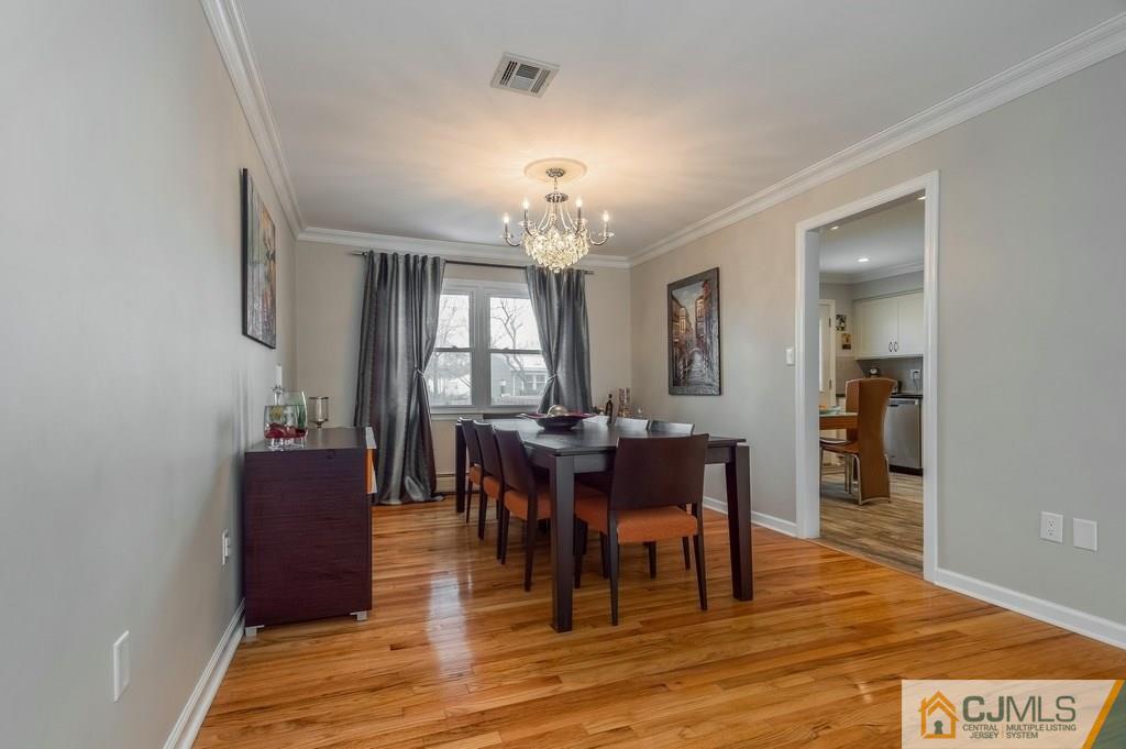 53 Lynnwood Road Edison, NJ 08820 - Photo 7 of 19 a view of a dining room with furniture and chandelier