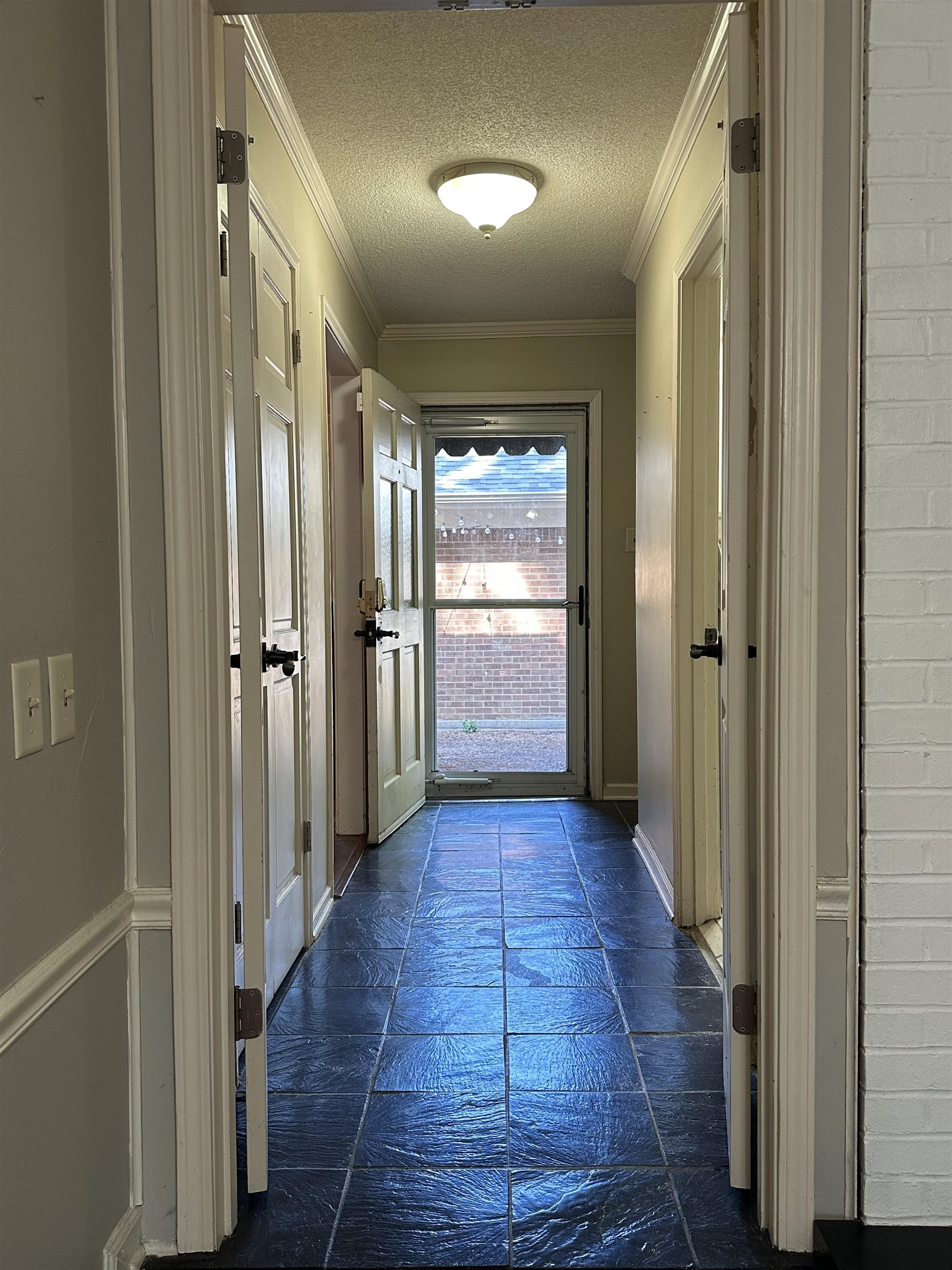 6939 Amberly Road, Unit 6939 Memphis, TN 38119 - Photo 2 of 14 a view of a hallway with wooden floor and a bathroom