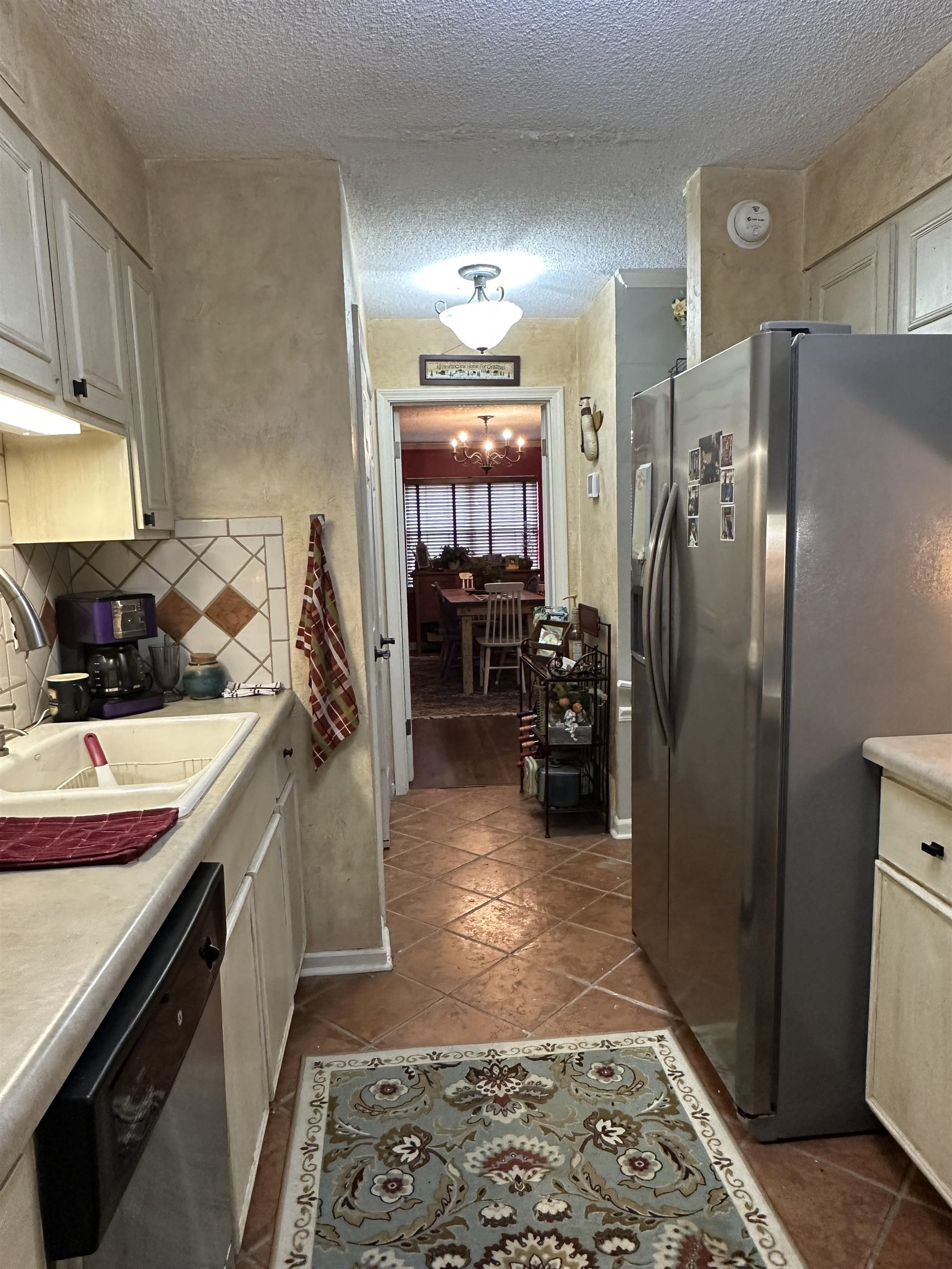 6939 Amberly Road, Unit 6939 Memphis, TN 38119 - Photo 7 of 14 a kitchen with a refrigerator and a sink