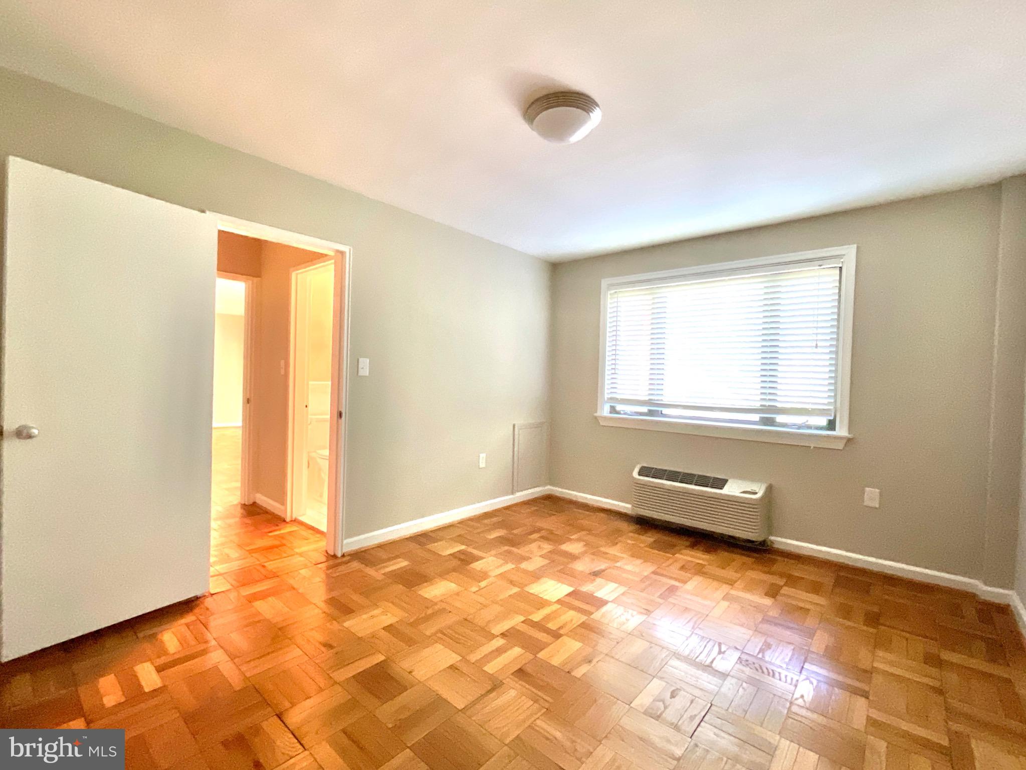 4114 Davis Place Northwest, Unit 210 Washington, DC 20007 - Photo 12 of 19 a view of a room with window
