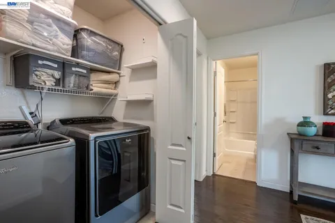 a kitchen with stainless steel appliances granite countertop a stove and a refrigerator