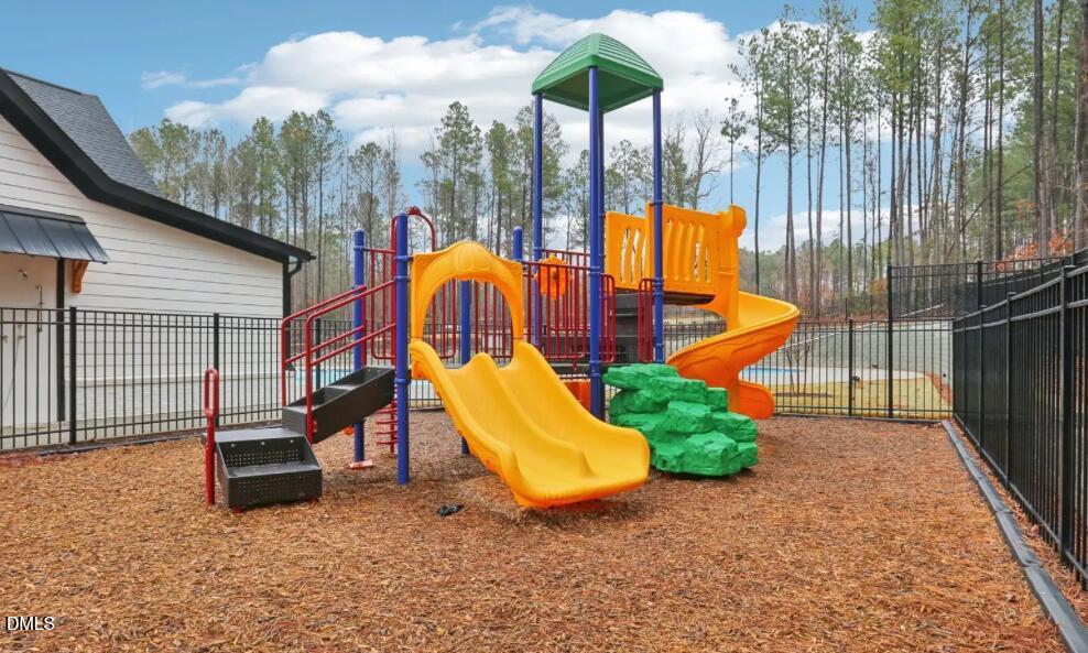 308 Karlov Road Garner, NC 27529 - Photo 52 of 55 a view of a park with slide
