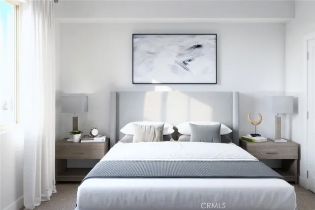 a bedroom with a bed and a painting on the wall