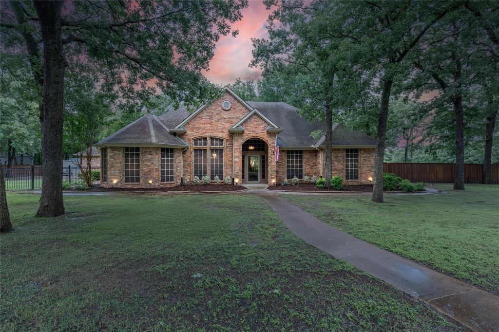 320 Rustic Oaks Road Combine, TX 75159 - Photo 3 of 40 View of front facade with a shingled roof and brick siding