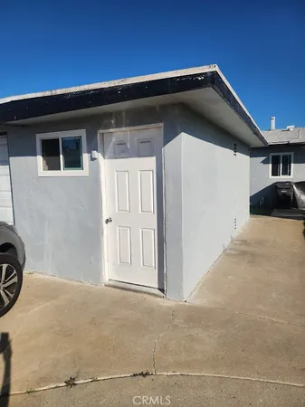 a front view of a house with parking space
