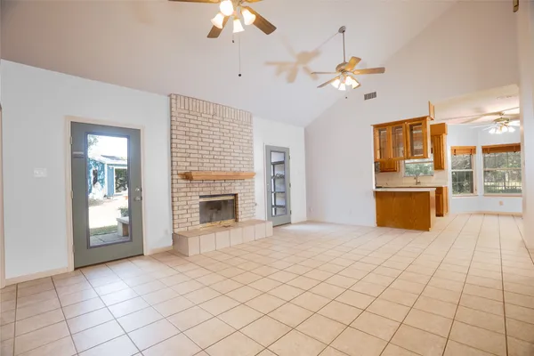 a view of a kitchen with a sink and a chandelier fire place