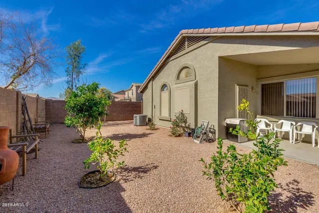 a front view of a house with outdoor seating