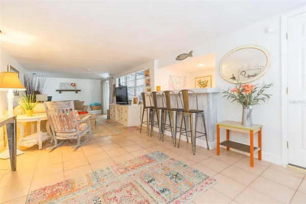 a bedroom with furniture and a flat screen tv