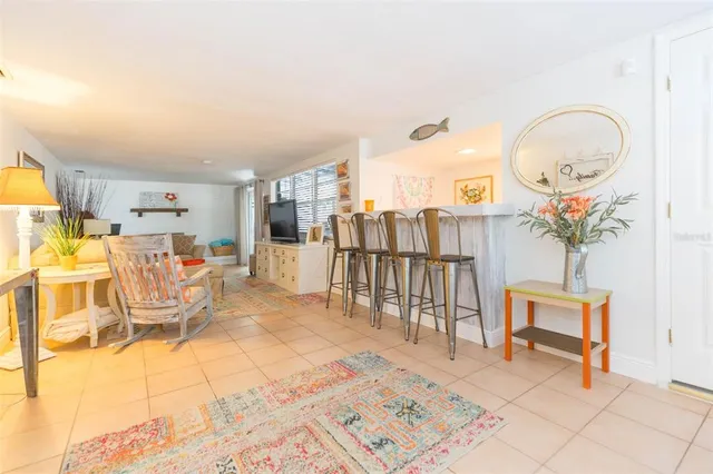 a bedroom with furniture and a flat screen tv