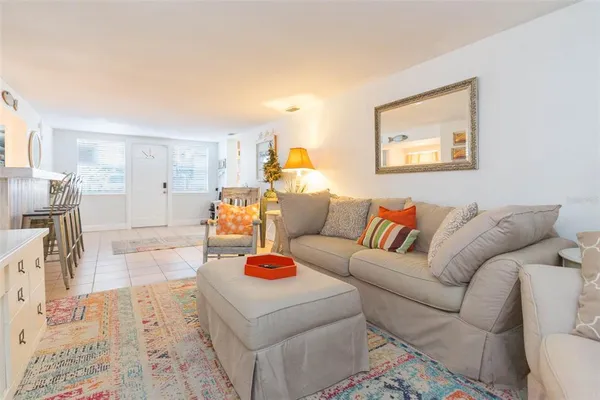 a bedroom with a bed chandelier and a chandelier