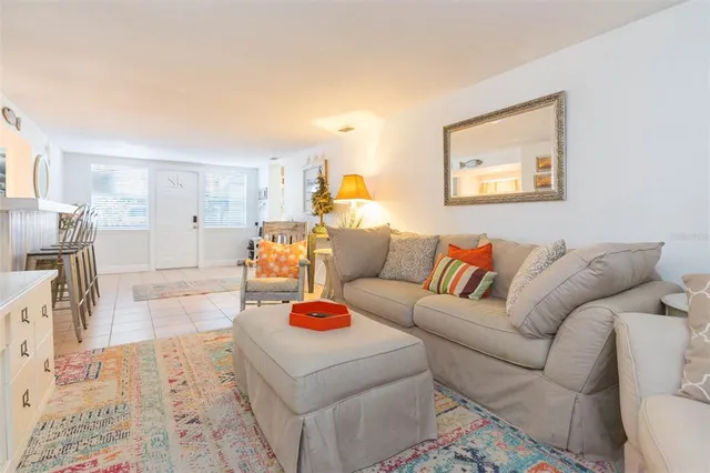 a bedroom with a bed chandelier and a chandelier