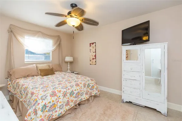 a bathroom with a sink a toilet and shower curtain