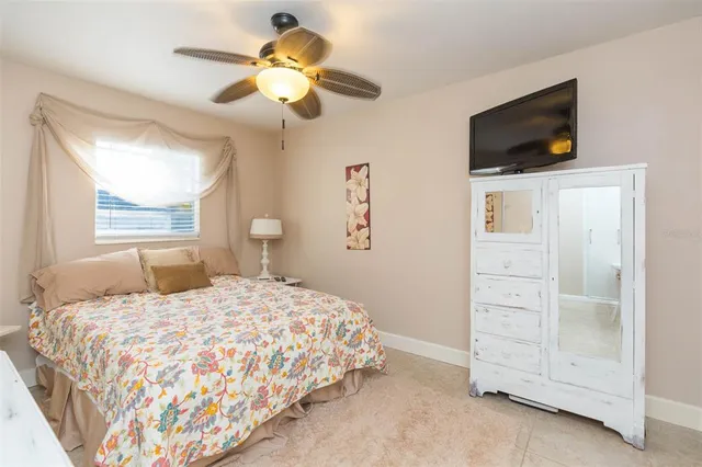 a bathroom with a sink a toilet and shower curtain