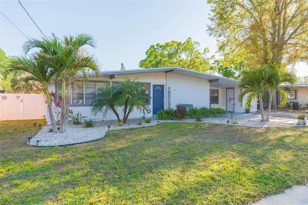 a view of a livingroom with furniture and a window