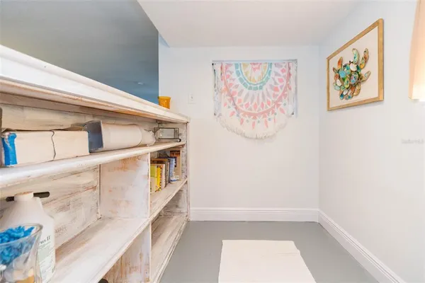 a living room with fireplace furniture and a large window