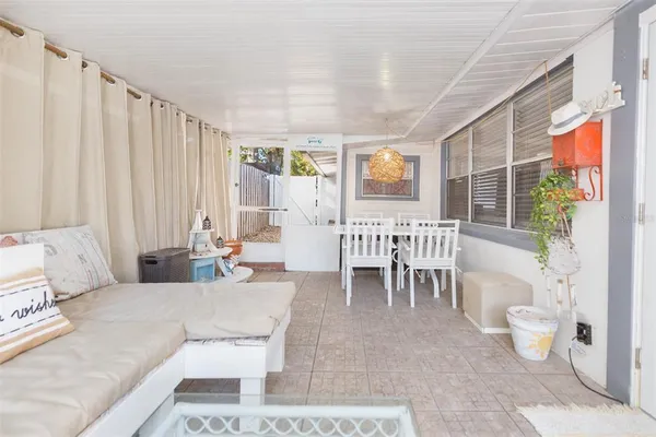 a view of a backyard with swimming pool