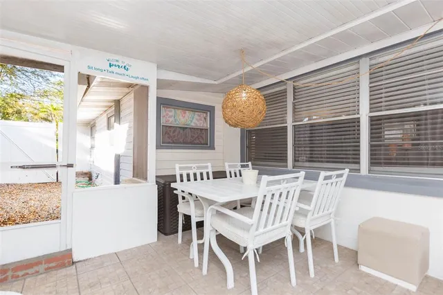 a view of a chair and table in the garden