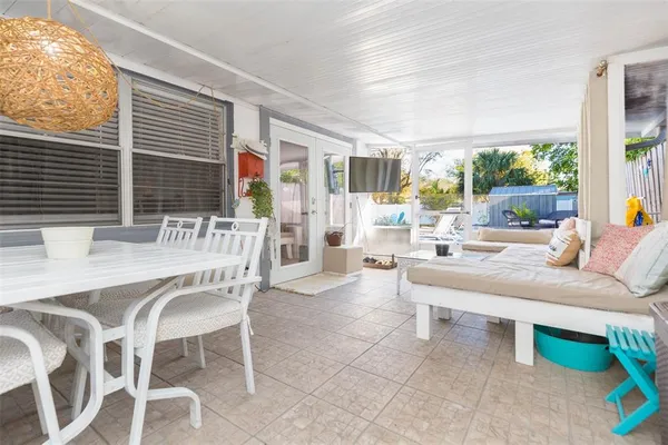 a swimming pool with outdoor seating