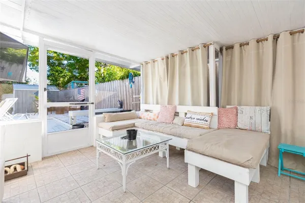 a view of swimming pool with a yard and seating space