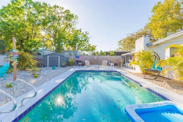 a view of a park with large trees