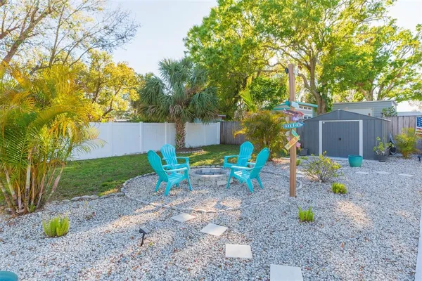 a view of a garden with a building in the background