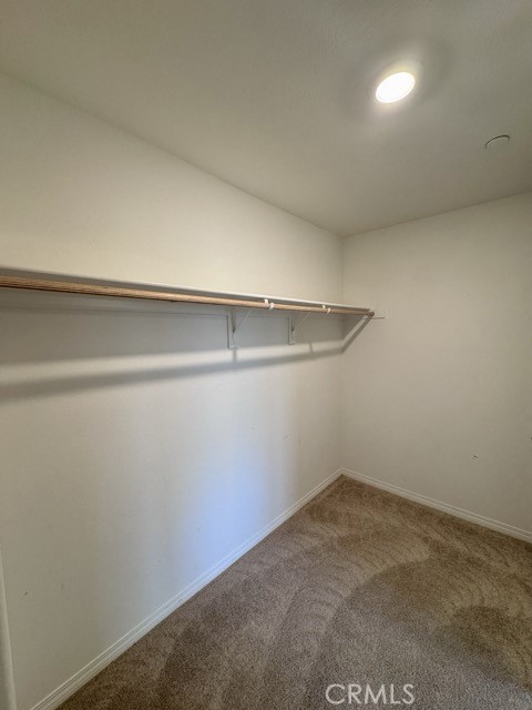 30115 Adrift Lane Menifee, CA 92584 - Photo 25 of 60 a view of a room with racks on the wall