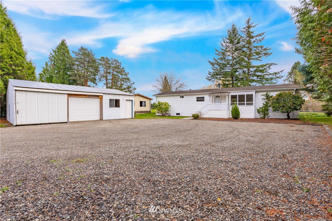 3177 Creasey Road Custer, WA 98240 - Photo 1 of 38 a front view of a house with garden