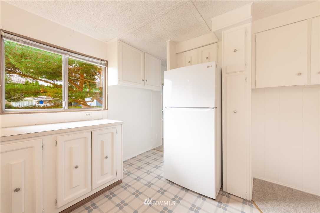 3177 Creasey Road Custer, WA 98240 - Photo 11 of 38 a white refrigerator freezer sitting inside of a kitchen
