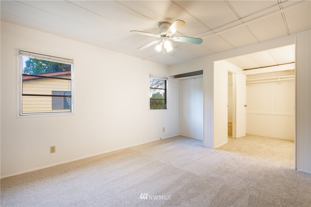 3177 Creasey Road Custer, WA 98240 - Photo 14 of 38 an empty room with chandelier fan and windows