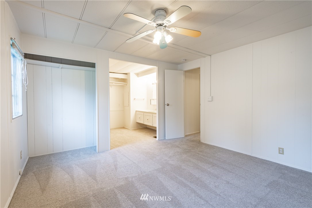 3177 Creasey Road Custer, WA 98240 - Photo 15 of 38 an empty room with closet and a ceiling fan