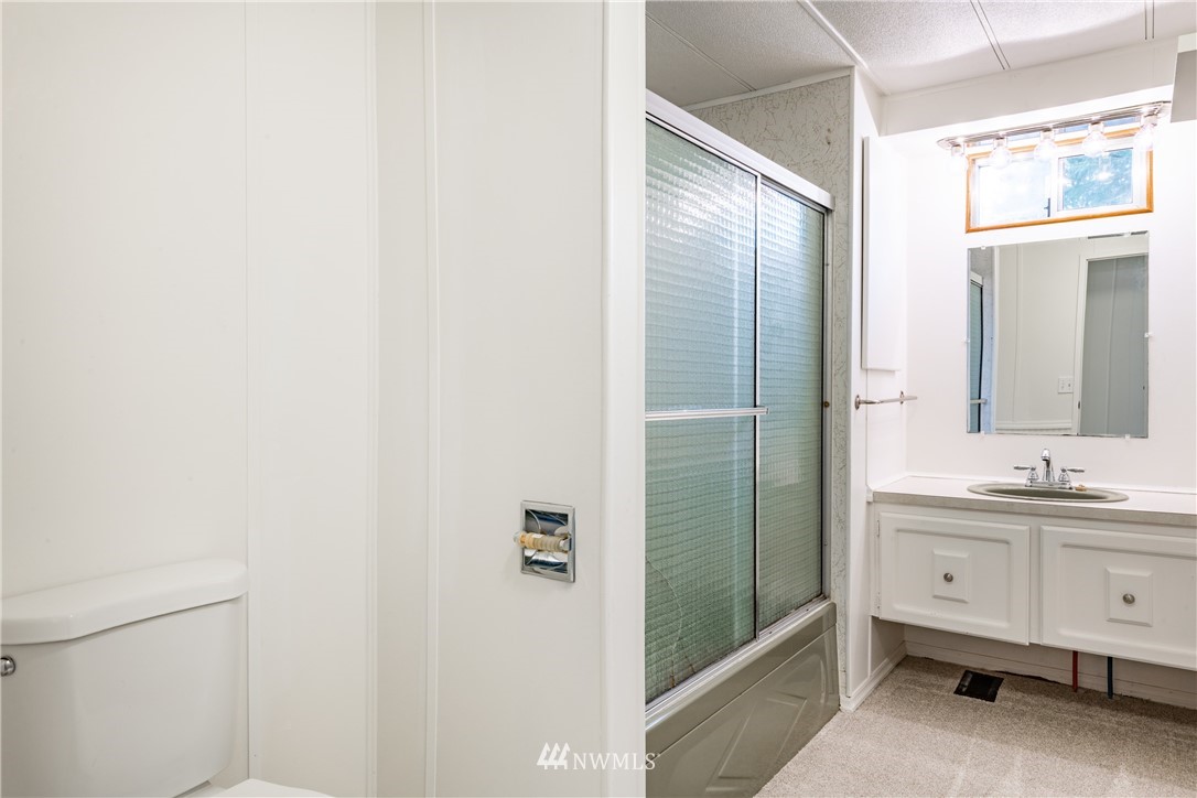 3177 Creasey Road Custer, WA 98240 - Photo 21 of 38 a bathroom with a double vanity sink and mirror