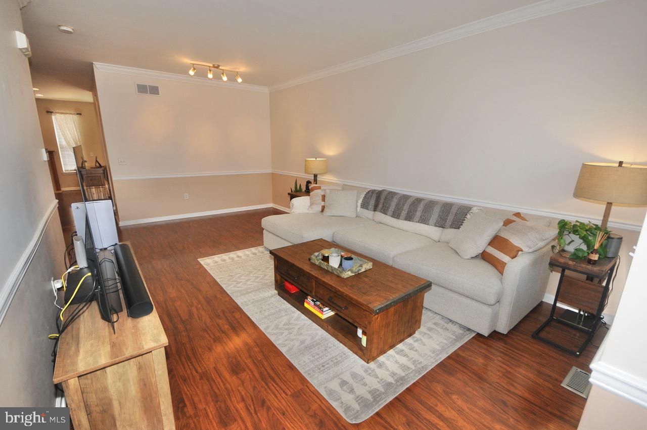 349 Huntington Drive Delran, NJ 08075 - Photo 12 of 68 a living room with furniture and a flat screen tv