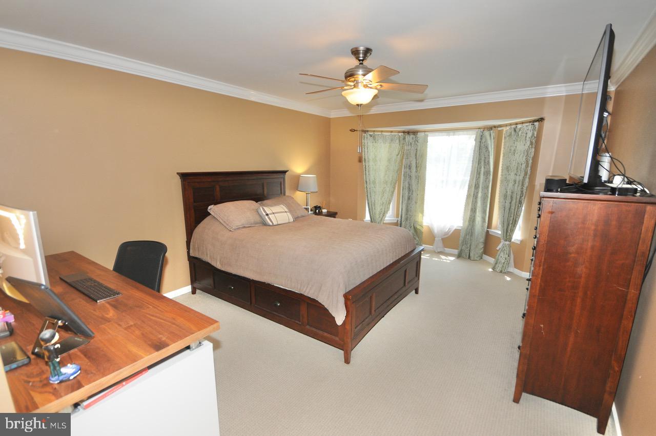 349 Huntington Drive Delran, NJ 08075 - Photo 22 of 68 a bedroom with a bed and a chandelier