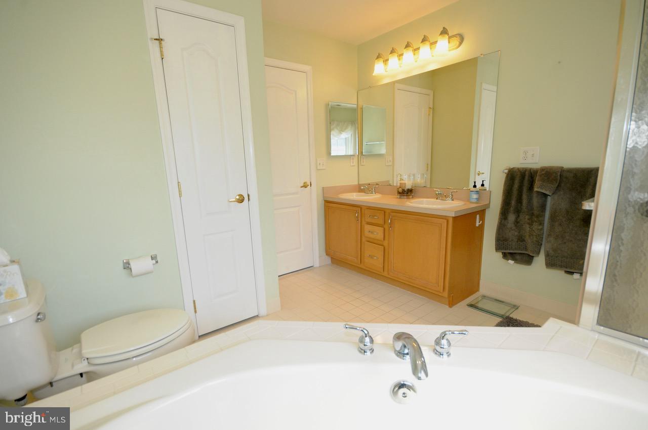 349 Huntington Drive Delran, NJ 08075 - Photo 24 of 68 a bathroom with a sink a toilet and shower