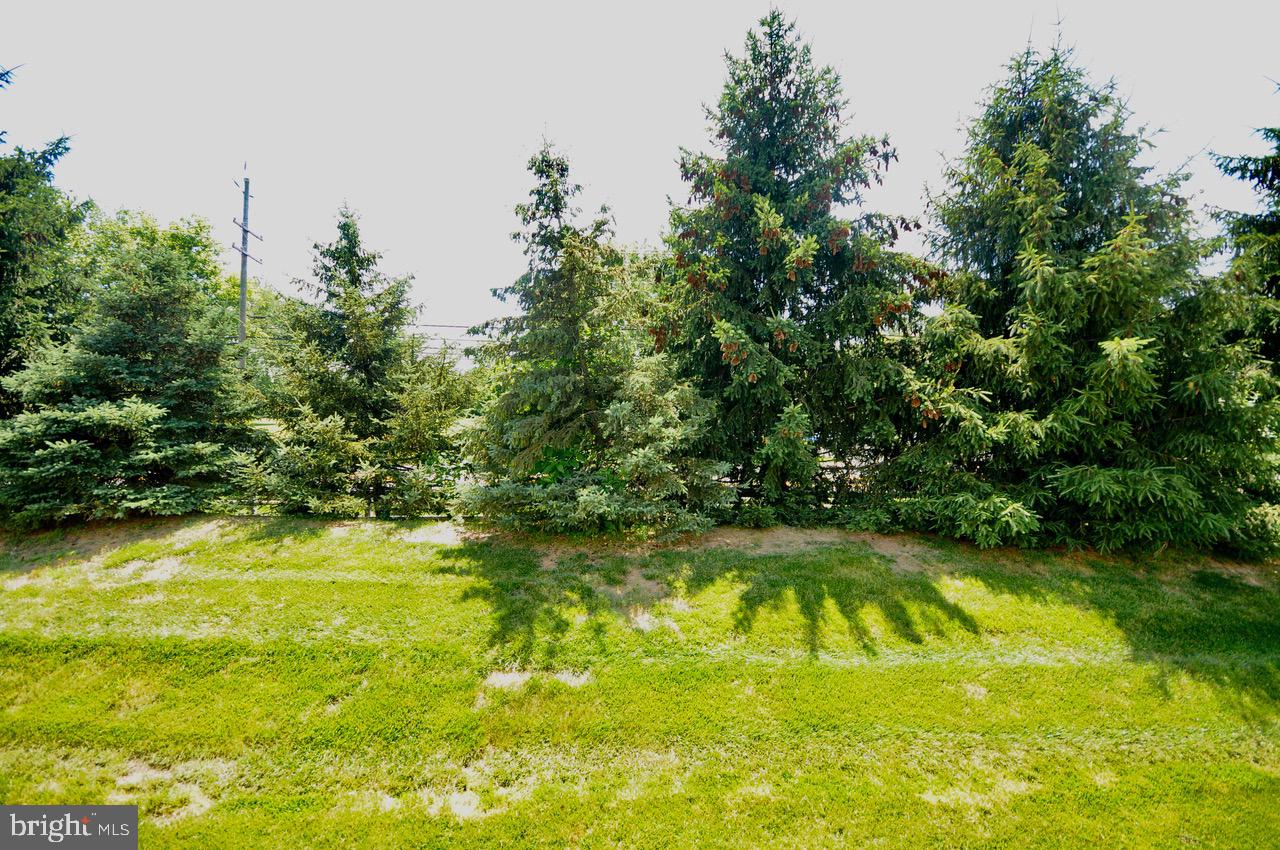 349 Huntington Drive Delran, NJ 08075 - Photo 40 of 68 a view of a swimming pool with an outdoor space and seating area