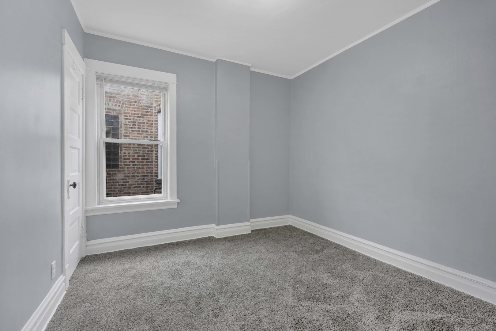 5015 West Montrose Avenue, Unit 2 Chicago, IL 60641 - Photo 15 of 23 an empty room with a window