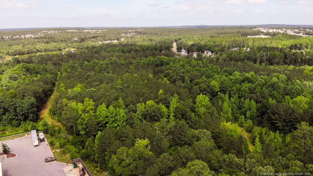 24-87 Nc Cameron, NC 28326 - Photo 19 of 28 an aerial view of residential houses with outdoor space and trees