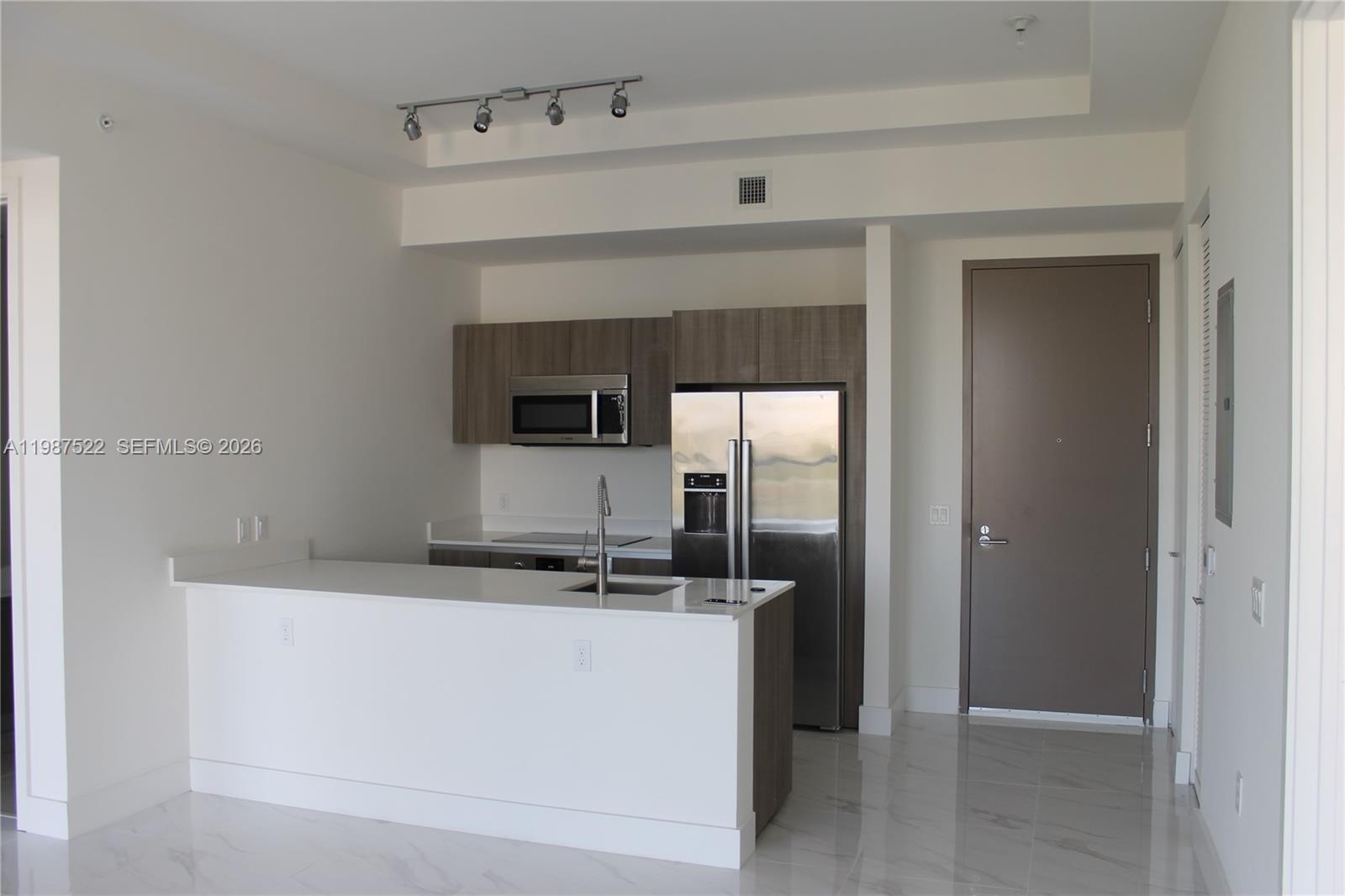 201 Southwest 17th Road, Unit 802 Miami, FL 33129 - Photo 5 of 20 a utility room with washer and dryer
