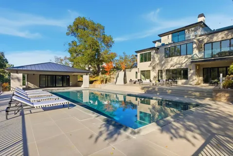 a view of a building with car parked