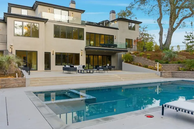 a view of a backyard with a patio