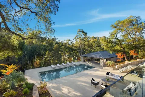a view of a swimming pool with a patio