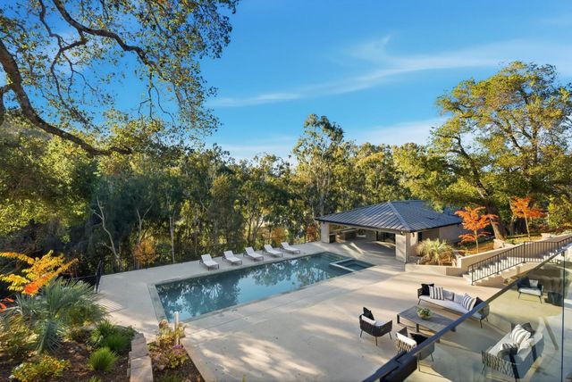 a view of a swimming pool with a patio