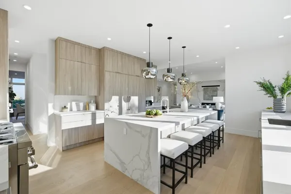 a large kitchen with a table and chairs